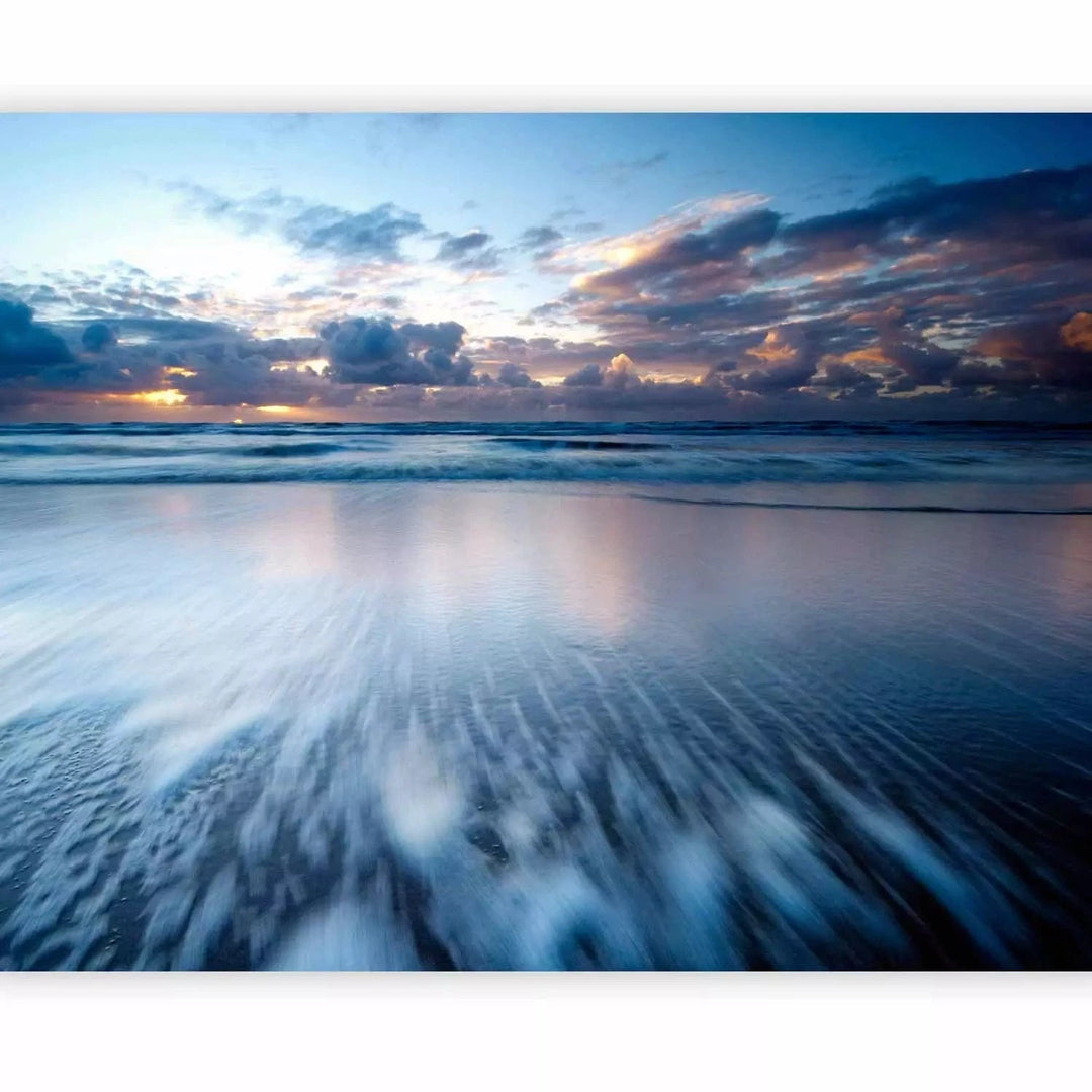 Fototapetes ar saulrietu virs zila okeāna - zilos toņos G-ART