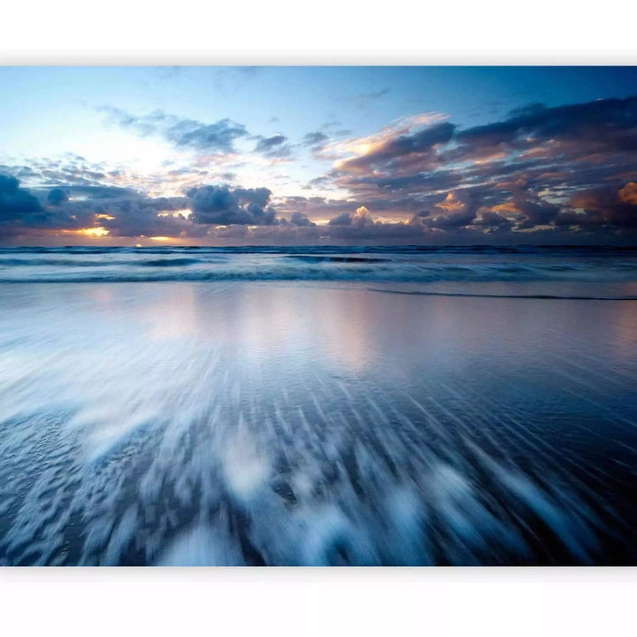 Fototapetes ar saulrietu virs zila okeāna - zilos toņos G-ART