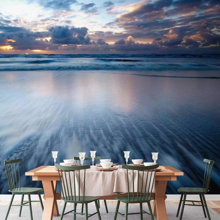 Fototapetes ar saulrietu virs zila okeāna - zilos toņos G-ART