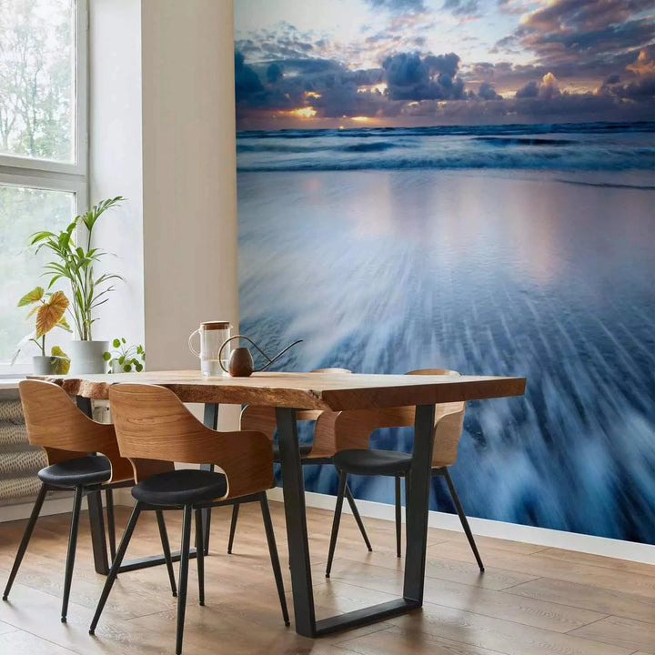 Fototapetes ar saulrietu virs zila okeāna - zilos toņos G-ART