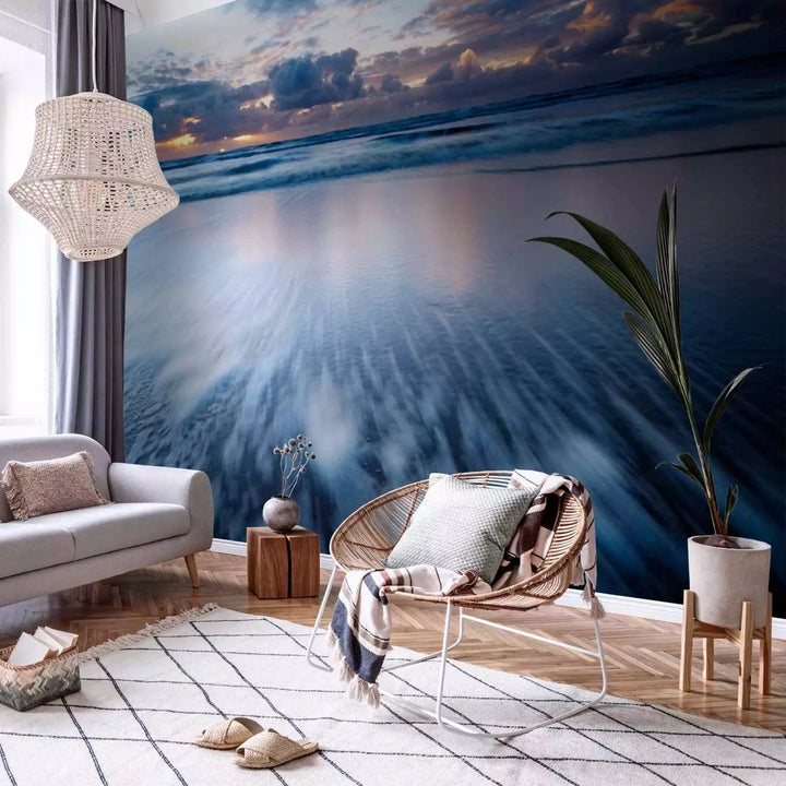 Fototapetes ar saulrietu virs zila okeāna - zilos toņos G-ART