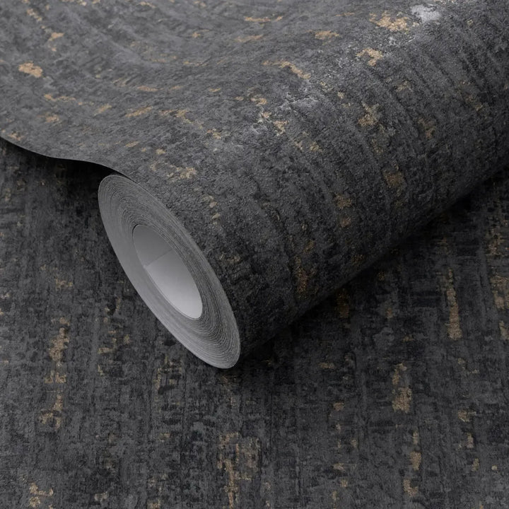 Close-up of a dark gray wallpaper roll clearly showing a rich relief texture with metallic gold accents for interior wall decor