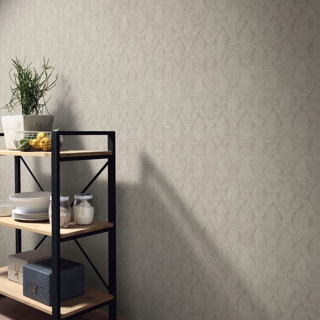 Natural beige non-woven wallpaper with geometric diamond pattern in a modern kitchen or living room interior with metal shelving and dishware.