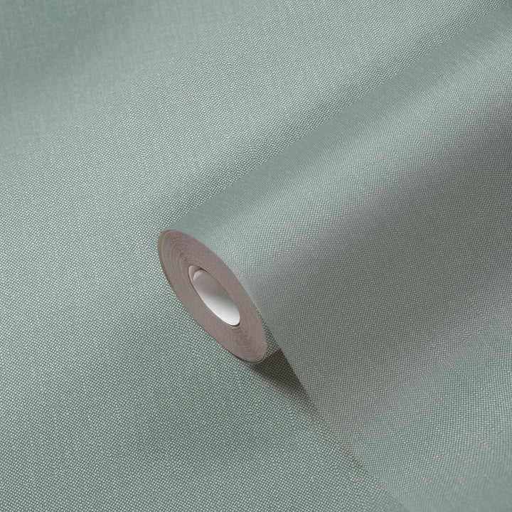 Flizelīna tapetes ar tekstila izskatu tumši zaļā krāsā – Silts un elegants sienu risinājums | 1410667 AS Creation