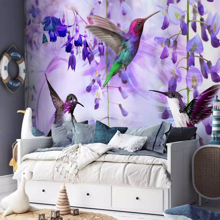 Fototapetes - Lidojoši kolibri starp ziediem violetā krāsā G-ART