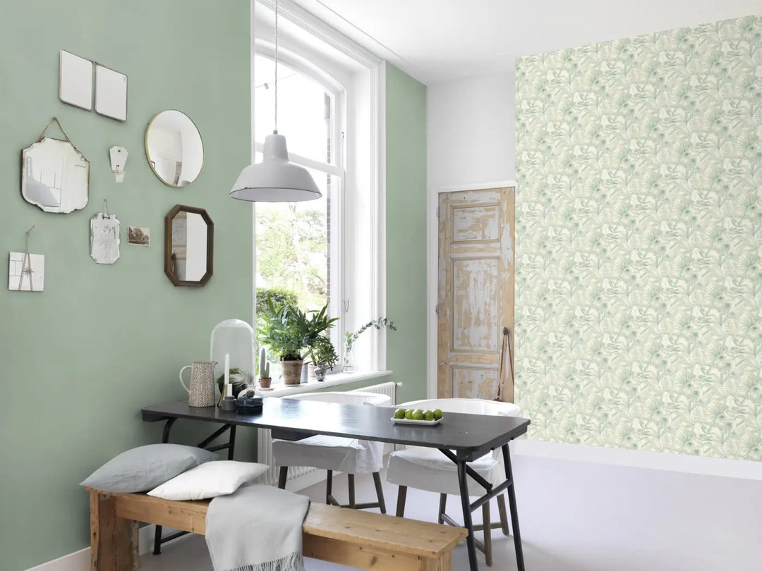 Rasch botanical-pattern wallpaper with a matt linen texture, combined with a plain green wall in a light-coloured dining room